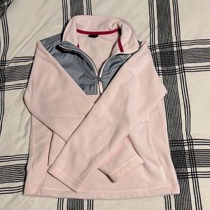 An amazing The North Face Jacket. Pink and grey color. Half zipped.